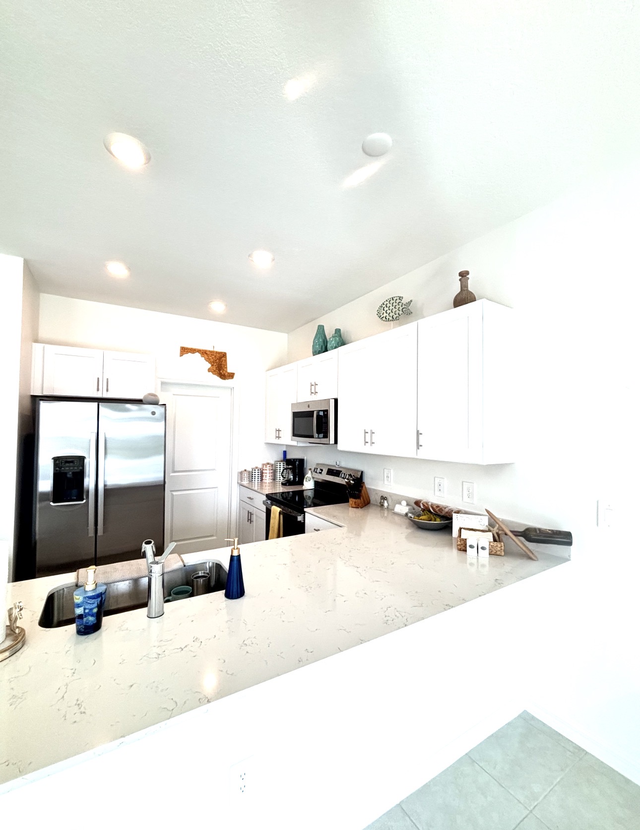 Bright white kitchen cabinets in a Painters Near Me residential project